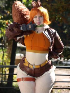 a woman dressed in a costume and holding a stuffed animal