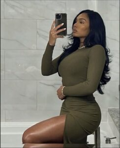 a woman is posing for a picture in a bathroom