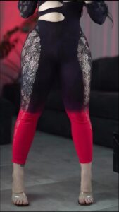 a woman in a black dress with a black headband