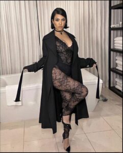 a woman in a black dress and black boots