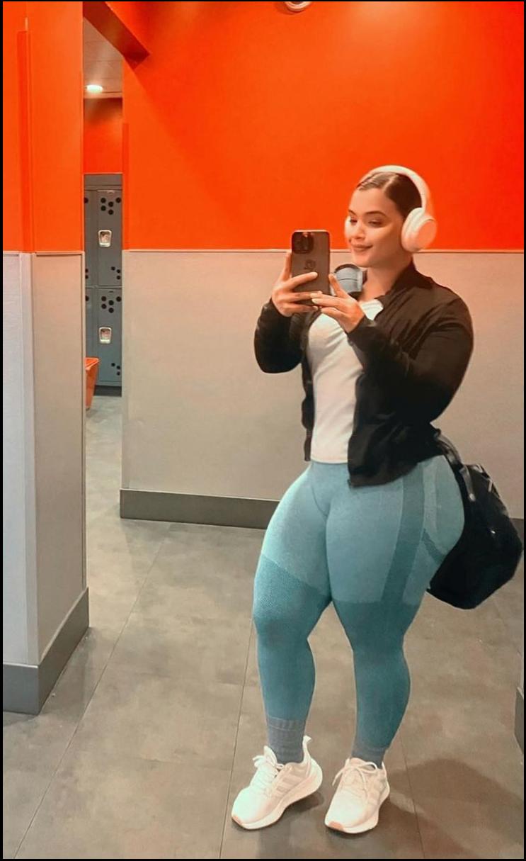 a woman is taking a picture of herself in a mirror