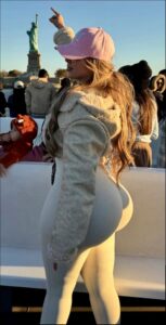 a woman dressed in a costume standing on a boat