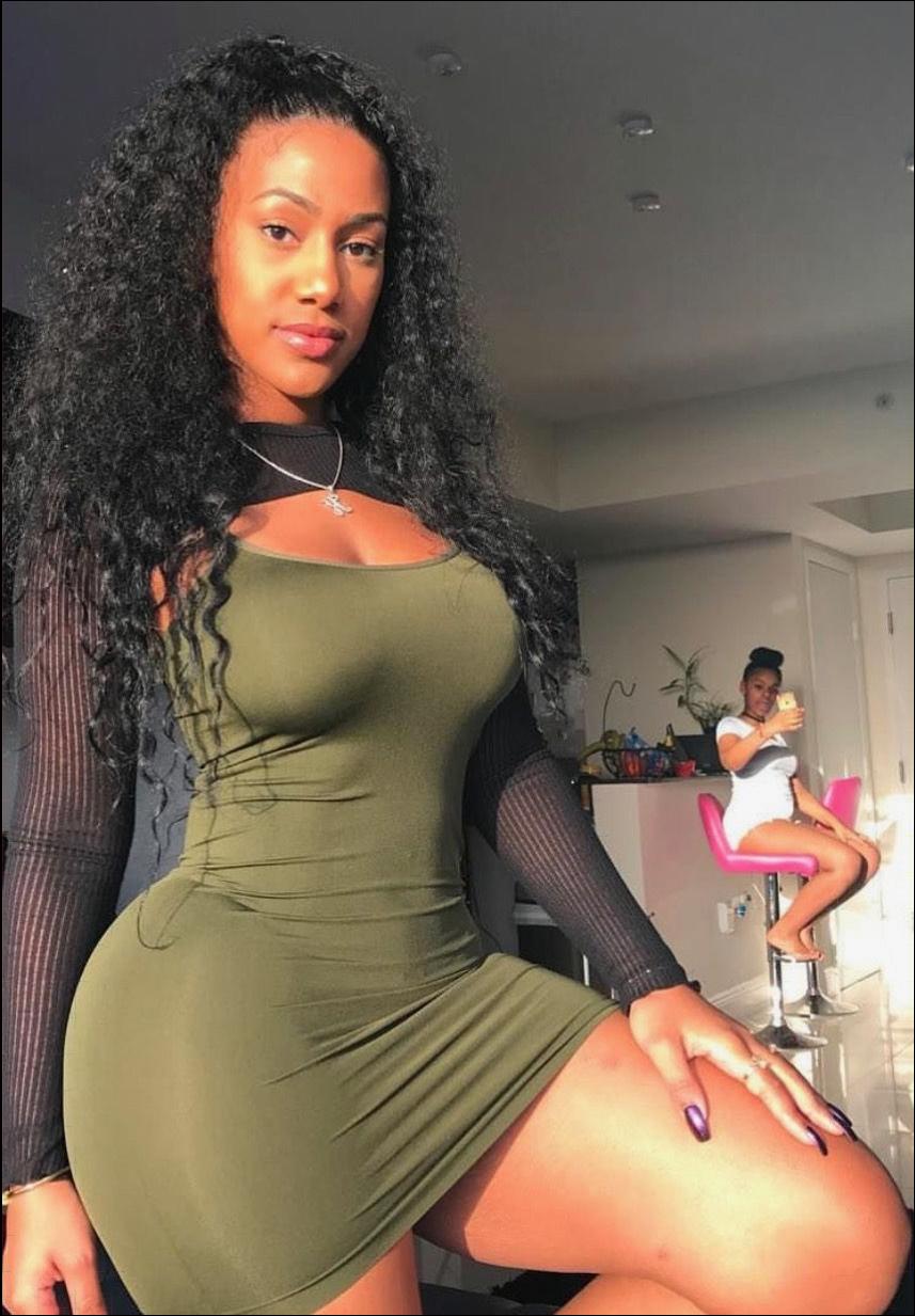 a woman in a black dress and a black and white t-shirt