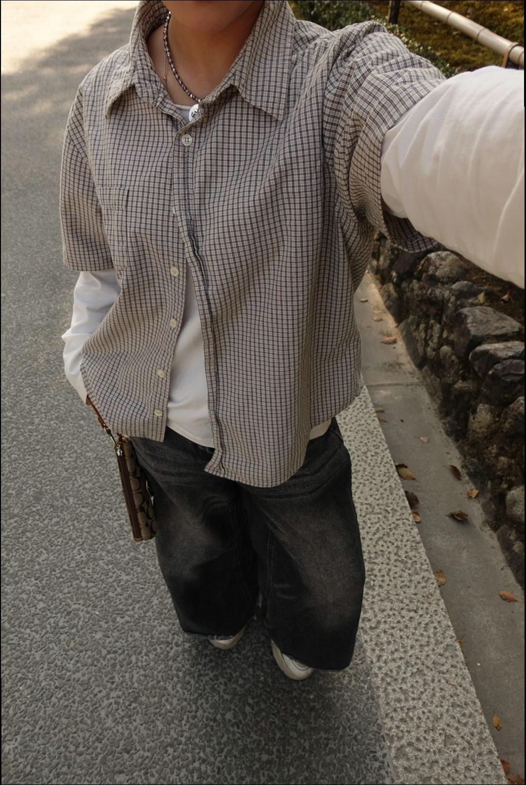a woman in a black shirt and a black skirt