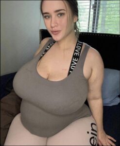 a woman in a black shirt and a black tie