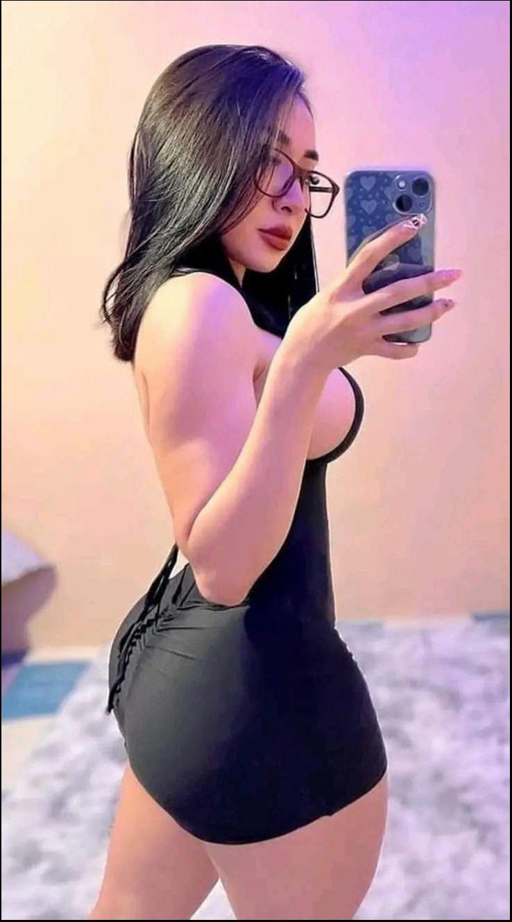 a woman is holding a cell phone in her hand