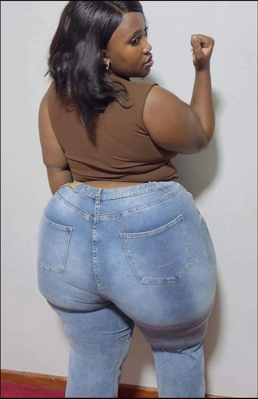 a woman is sitting on a wall with a blue and white object