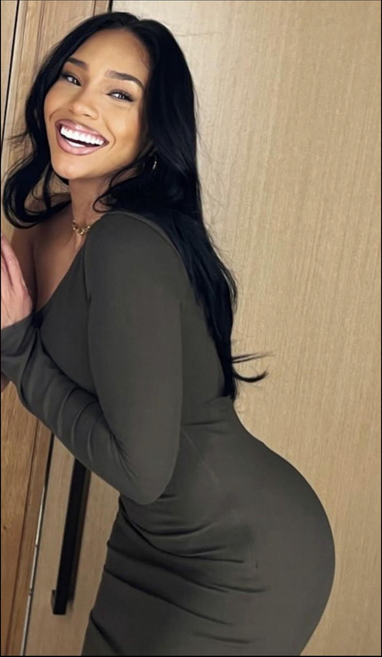 a woman in a black dress and a black tank top