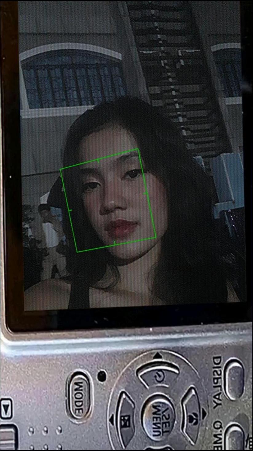 a woman is looking at a cell phone