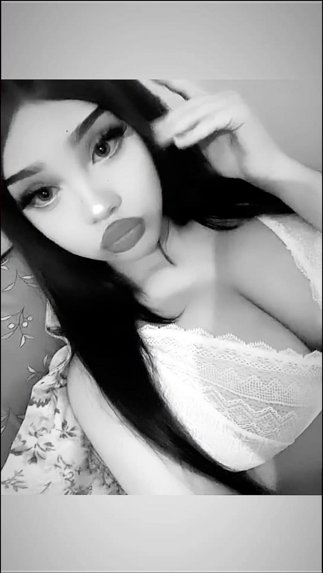 a woman is posing for a picture with a towel