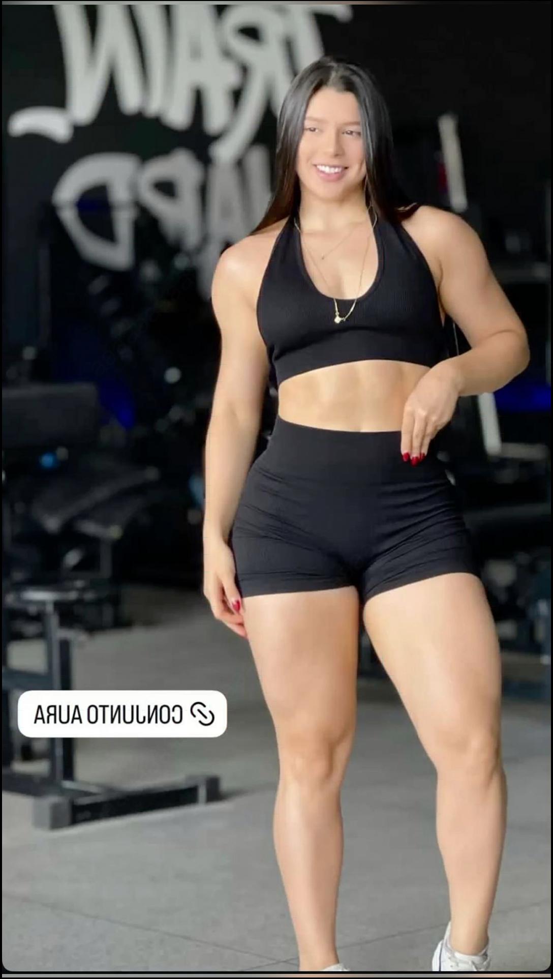 a woman in a black dress standing on a stage