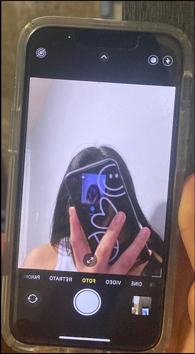 a person holding a cell phone in their hand