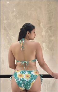 a woman in a bikini on a beach