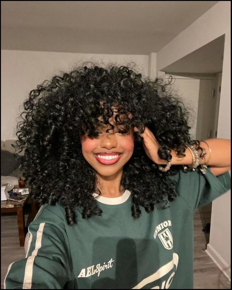 a woman with a red hair and a blue shirt