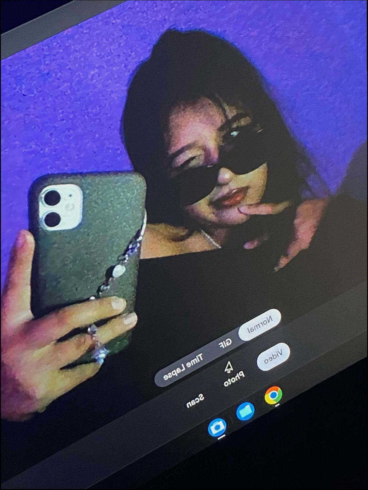 a woman is playing a video game on a tv