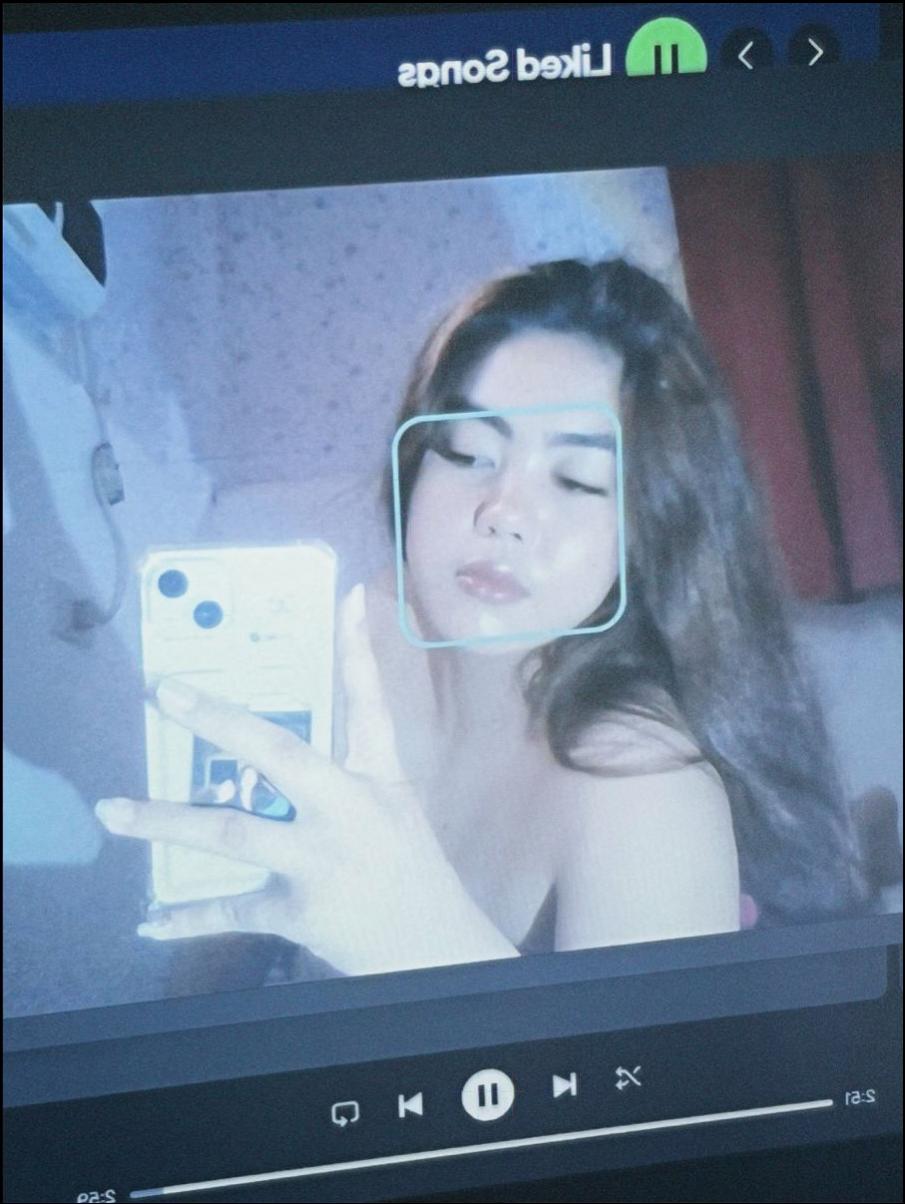 a woman is holding a wii remote and a tv