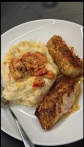 a plate of food with meat and vegetables