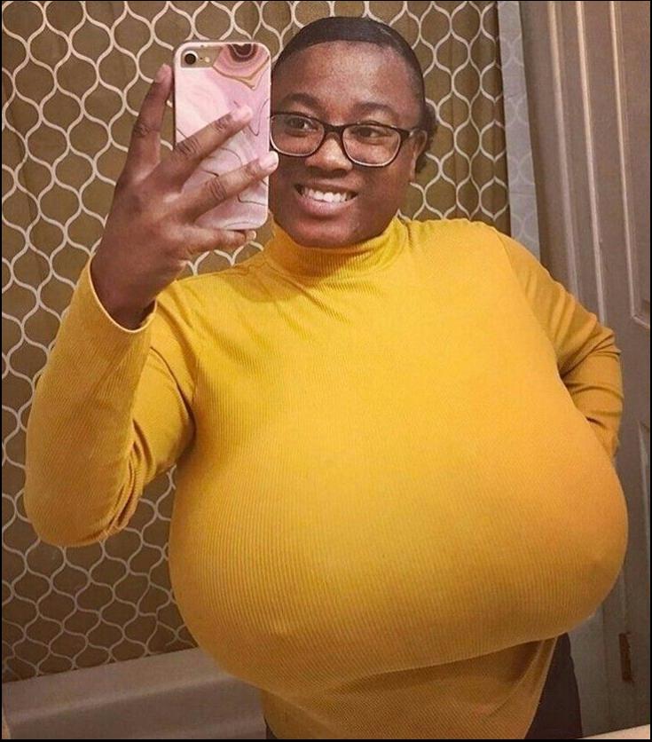 a man holding a stuffed animal in his right hand