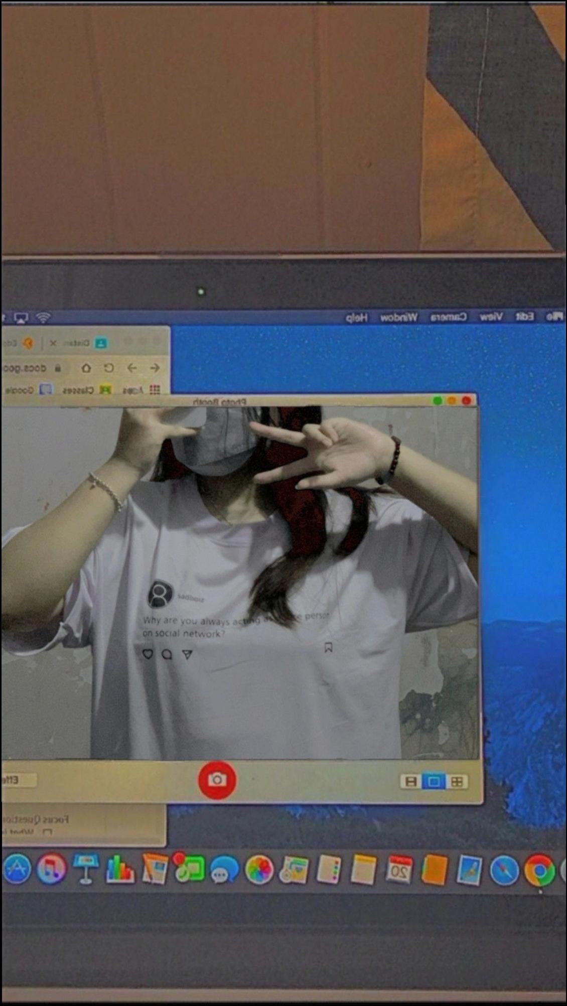 a man is taking a picture of a cat