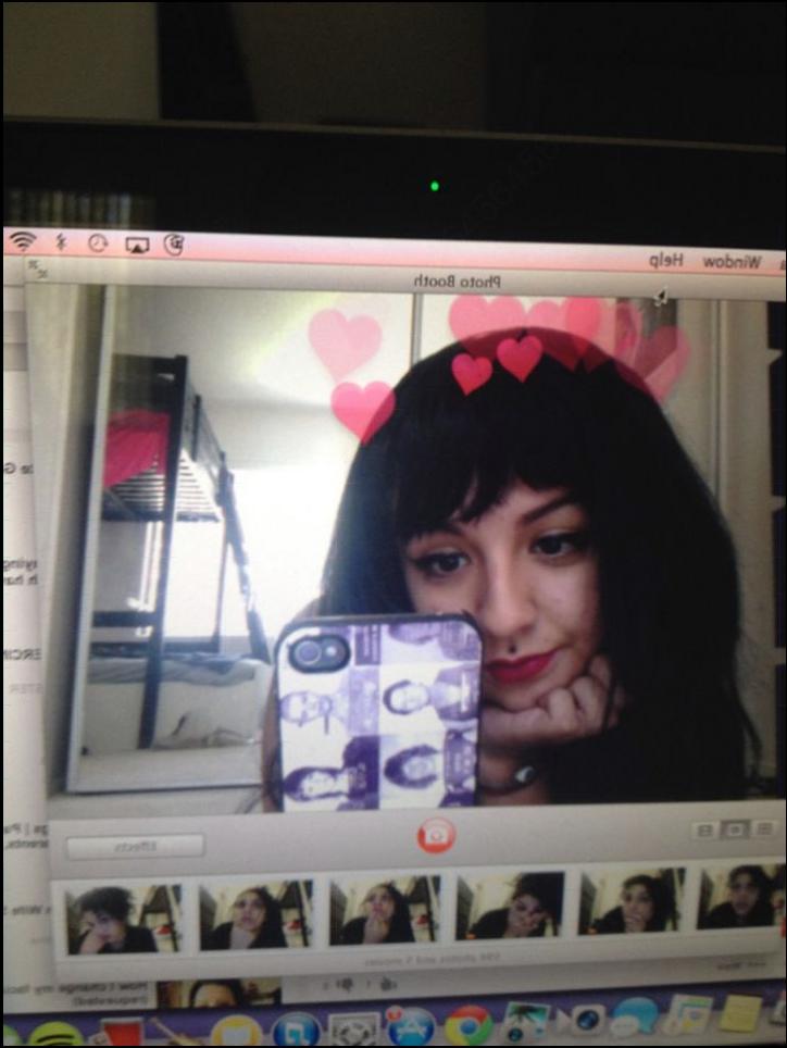 a woman holding a white and black tv