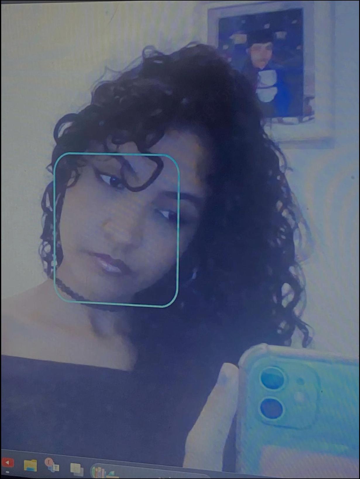 a woman taking a picture of herself in a mirror