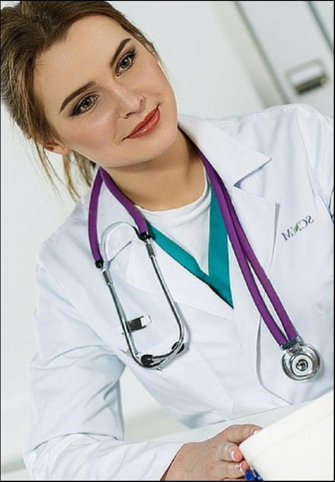 a woman in a white dress and a black and white striped tie