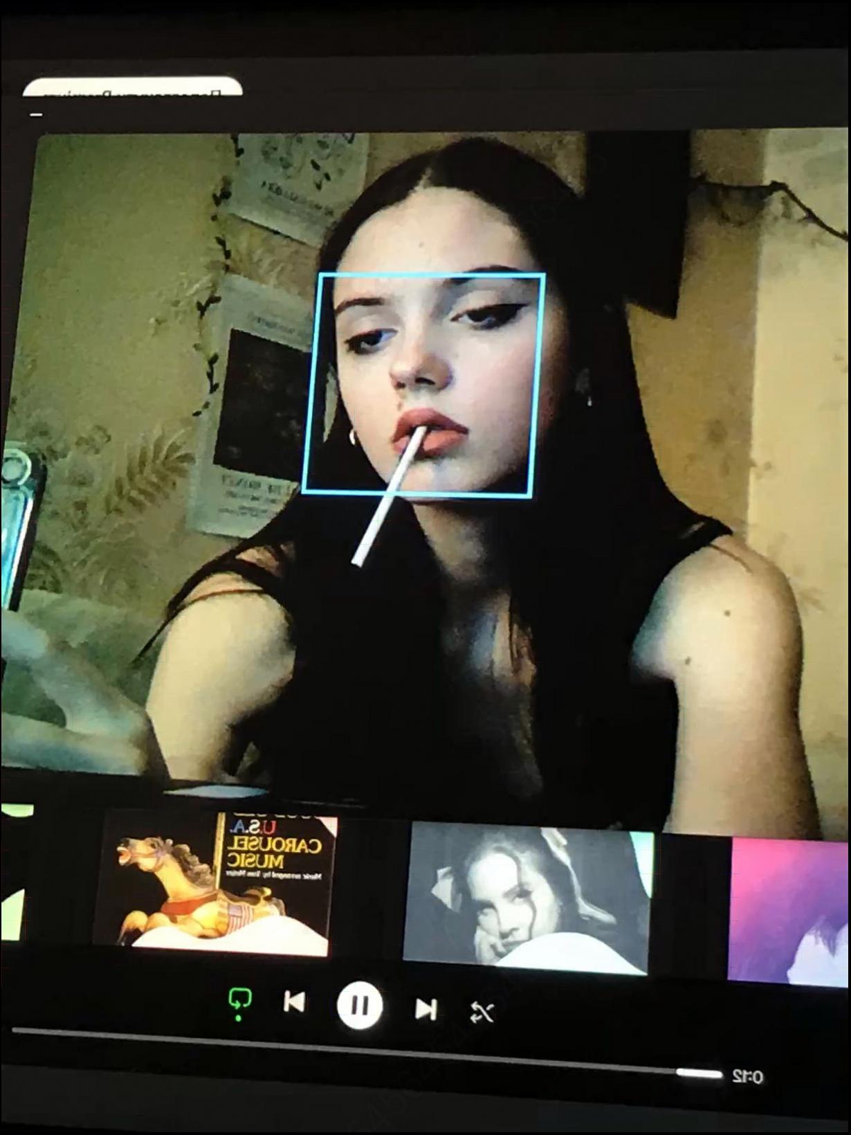 a woman is looking at a laptop screen