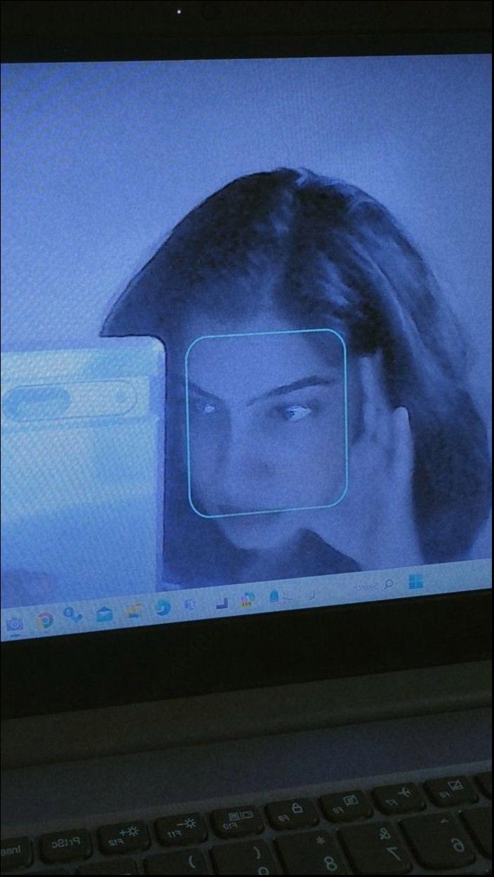 a woman is looking at a cell phone