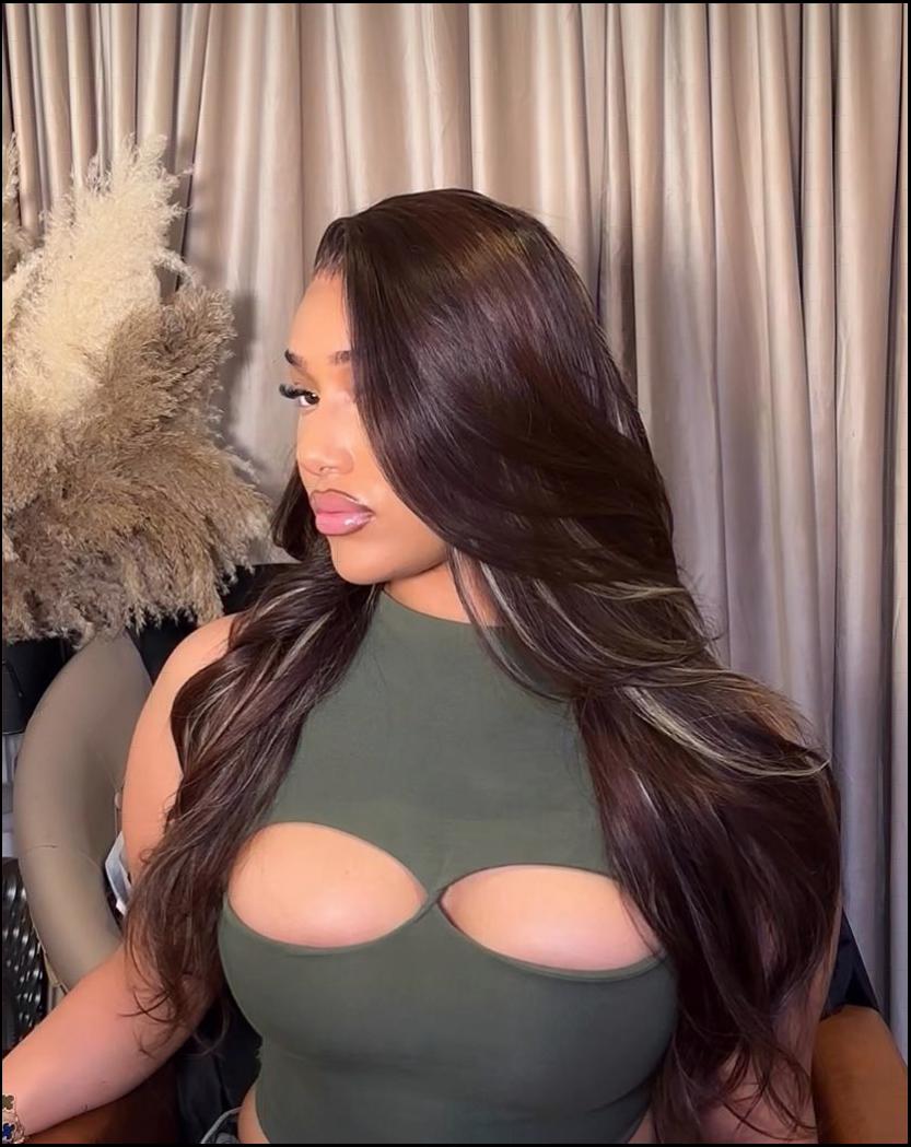 a woman wearing a black shirt and a black t-shirt