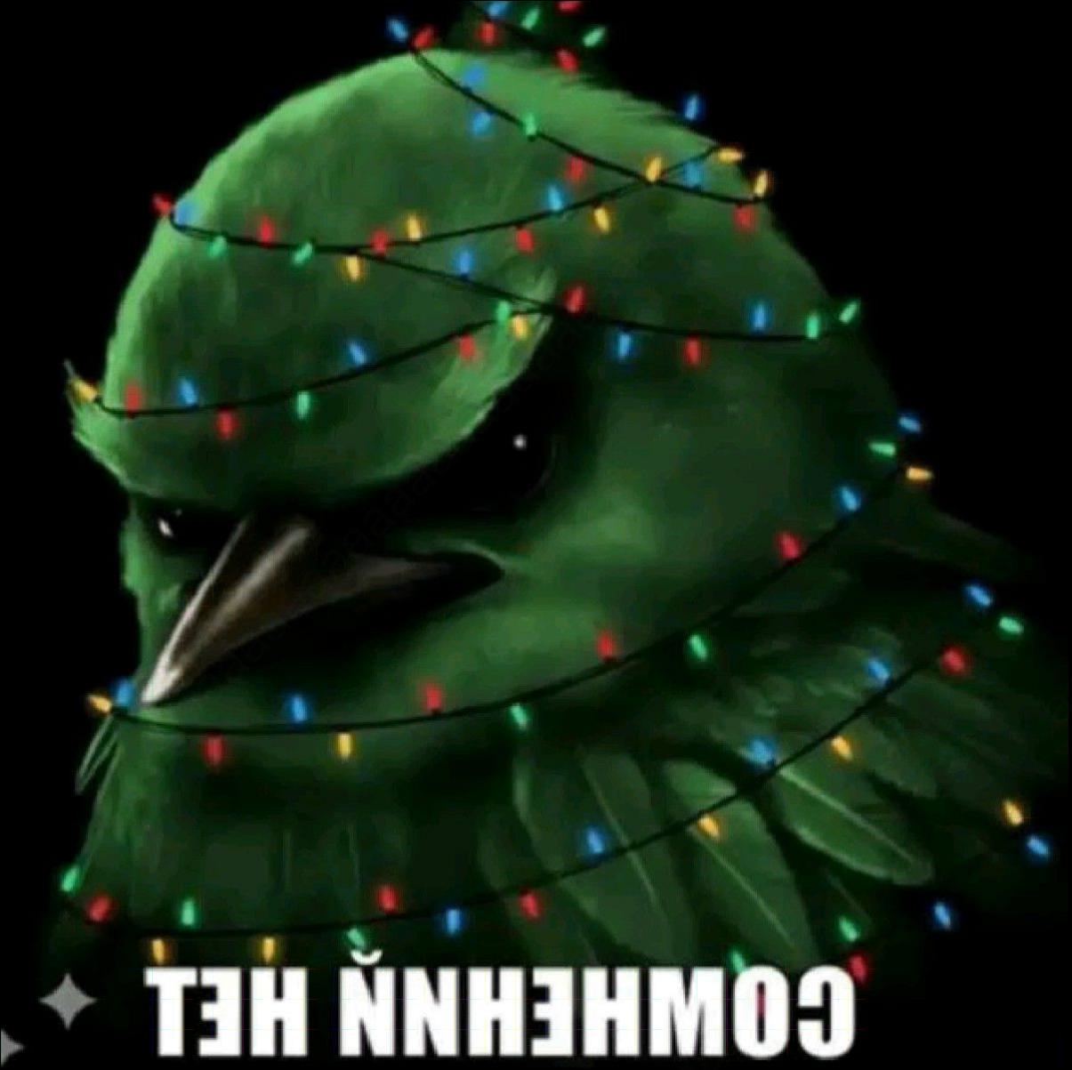 a large green and yellow elephant with a green head