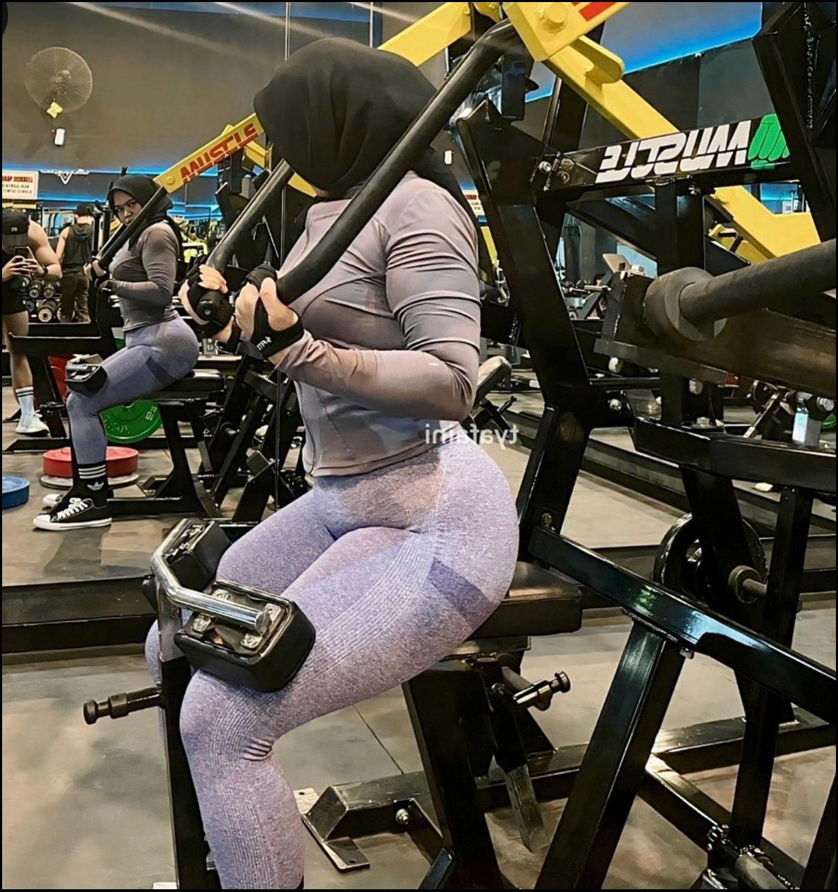 a woman wearing a black shirt and black boots