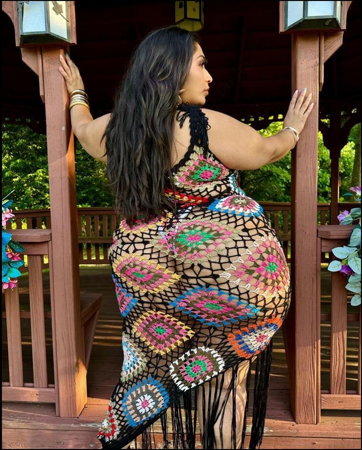 a woman is dressed up and posing for a picture