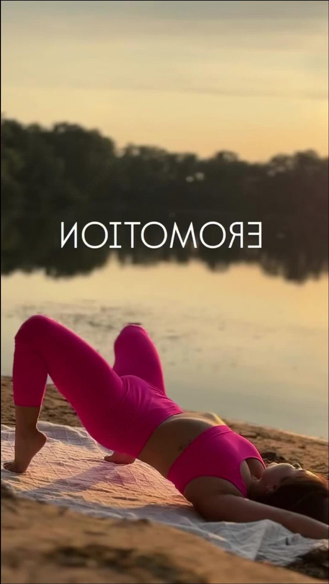 a woman laying on a beach with a surfboard