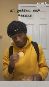 a man eating a banana on a white plate
