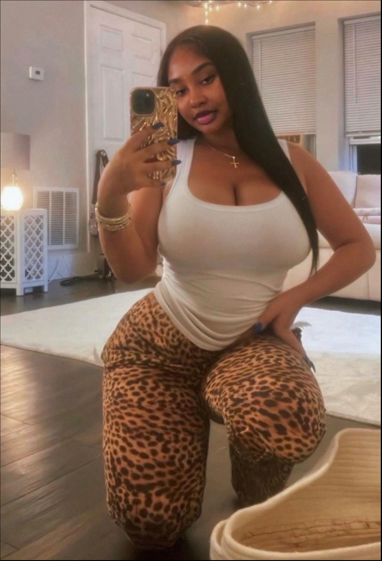 a woman is posing for a picture in a bathroom