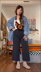 a woman sitting on a couch holding a stuffed animal