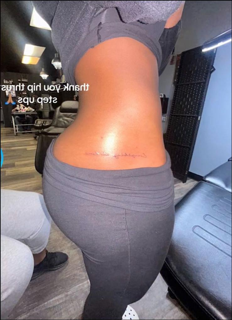 a woman is wearing a black and white striped shirt