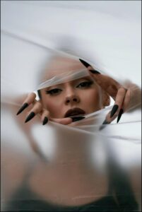 a woman with a knife and a towel